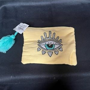 Change purse with eye and tassel